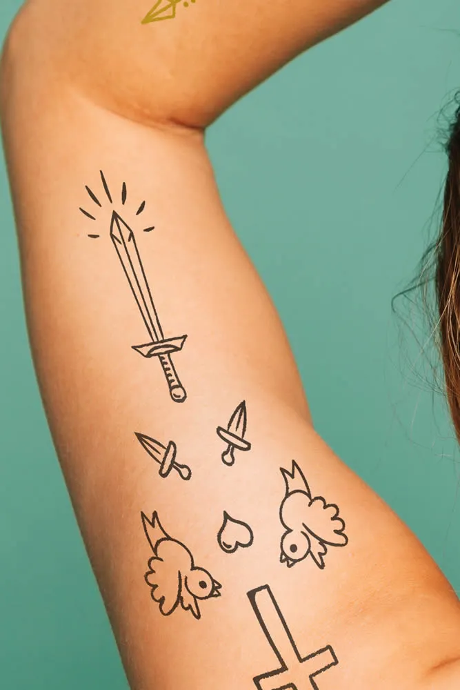 happy mature woman bad tatoo on arm