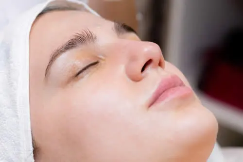 age-spots cosmetic-dermatology-treatment-jetpeel-girl-on-table-receives-procedures