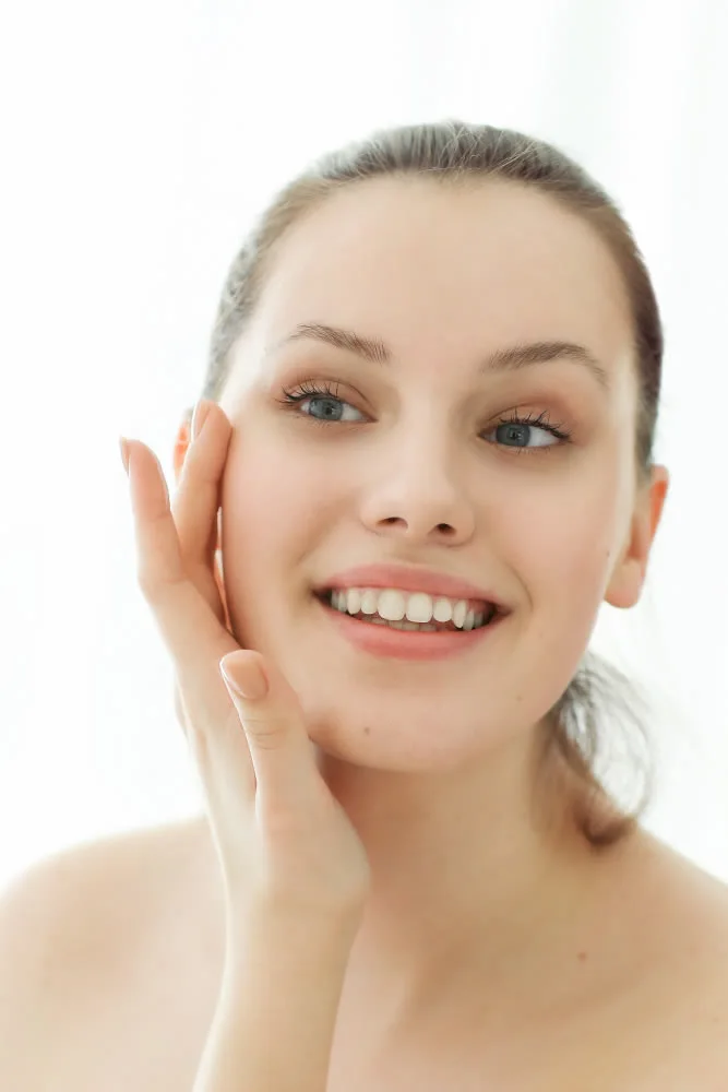 happy mature woman woman-after-jetpeel-looking-mirror